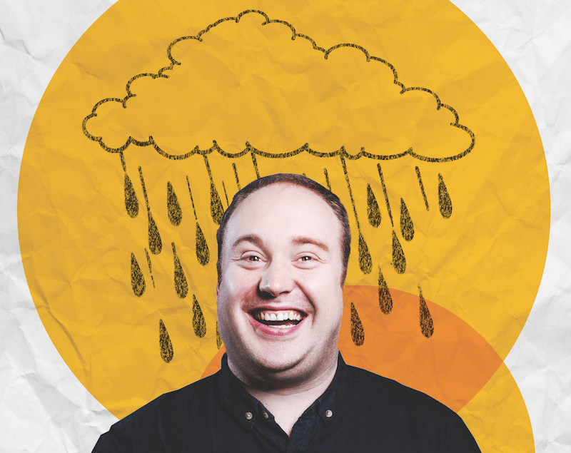 A man looks towards the camera laughing, behind him is a drawn rain cloud in a yellow circle.