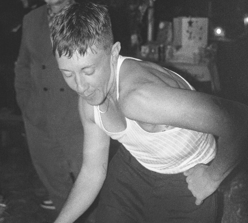 A black and white photo of a person dancing.